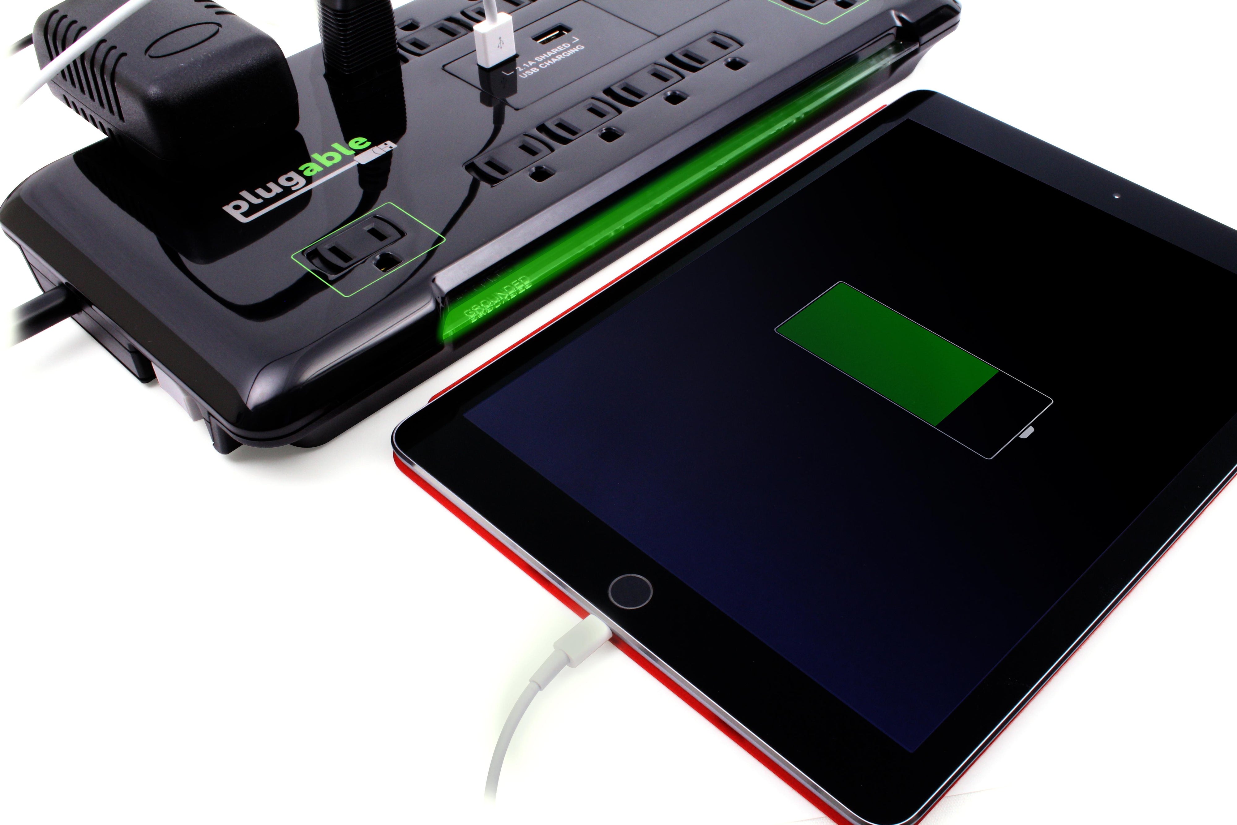 An image of the ps12-usb2b power strip connected to a iPad with multiple devices connected to its ports.