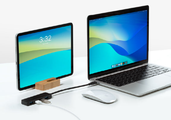 The USBC-HUB4A connecting to USB devices to a laptop.