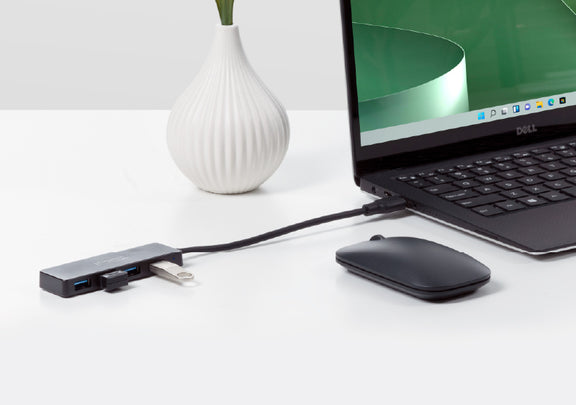 The USB3-HUB4A connecting two USB devices to a laptop.