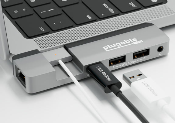Close up of the hub connected to a USB 40 Gbps cable and a USB 5Gbps cable