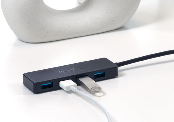 The USBC-HUB4A width a USB device and Thumb Drive connected to it.